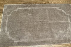 Plush beige Area rug 5 1/2 feet by 3 1/2 feet. Rubber backing. in Chicago, Illinois