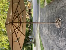 Patio umbrella and stand in Lockport, Illinois
