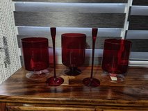 bundle of red glass candle holders in Lakenheath, UK