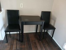 wood table & two chairs in Alamogordo, New Mexico