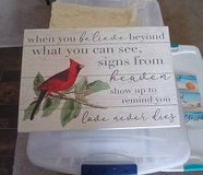 A new wood sign with a red beautiful cardinal in Alamogordo, New Mexico