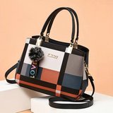 Stylish Geometric Colorblock Women's Handbag with Pompom Charm in Chicago, Illinois