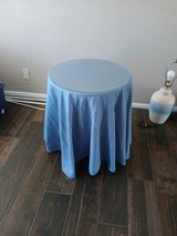 Wood table with tablecloth and glass top in Alamogordo, New Mexico