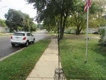 Metal coat tree with umbrella holder in Oswego, Illinois