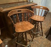 wood bar with 2 bar chairs in Fort Carson, Colorado