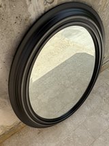 Black oval mirror in Okinawa, Japan