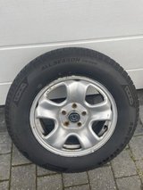 Honda rims with all-season tires. in Ramstein, Germany