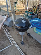 Weber Kettle grill with charcoal lighter can in Yucca Valley, California