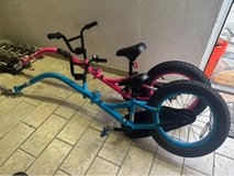 Tag along / Pull Behind Kids Bikes (1 pink / 1 blue) Kazam Link (16”) - Like new! in Spangdahlem, Germany