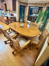 Pure oak dining room table with chairs in Naperville, Illinois