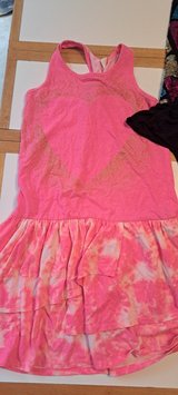 Size SMALL. Pink dress is a Xlarge but fit like a small in Okinawa, Japan