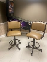 2 leather and rod iron swivel bar height stools. in Naperville, Illinois