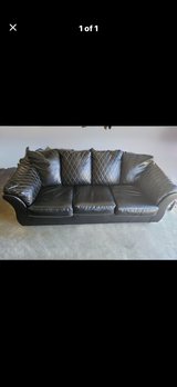 Black leather sofa in Perry, Georgia