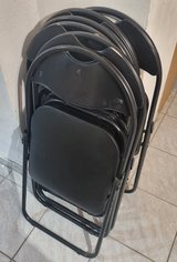 6 black folding chairs in Ramstein, Germany