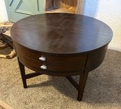 Round walnut veneer coffee table in Alamogordo, New Mexico