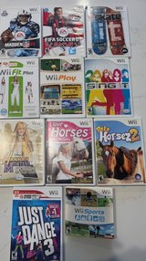 11 Wii games, Wii console, 2 controllers, microphone, balance board, etc in Chicago, Illinois
