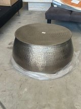 Carved metal table in silver color with storage capacity. in Kingwood, Texas