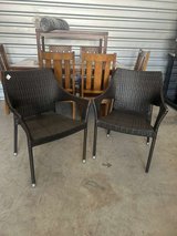 Set of two dark brown wicker chairs in Kingwood, Texas