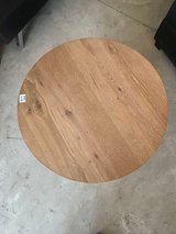 Round wooden coffee table in Houston, Texas