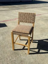 New wooden bar chair featuring a brown leather seat and a handwoven leather backrest in Kingwood, Texas