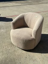 Beige foam swivel chair with a modern and elegant design. in Houston, Texas