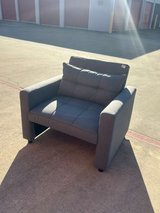 Gray padded armchair in Houston, Texas