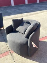 Modern round accent chair in gray fabric in Kingwood, Texas