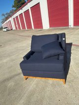 Navy padded armchair with armrests in Kingwood, Texas