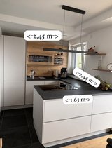 Modern kitchen, satin matt, wood look with dark countertop in Baumholder, GE