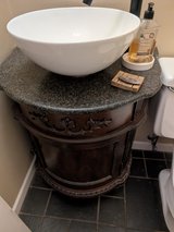 Wooden vanity with sink and faucet in Plainfield, Illinois