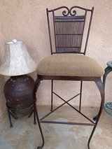 Brown metal bar stool and beige upholstery in Yucca Valley, California