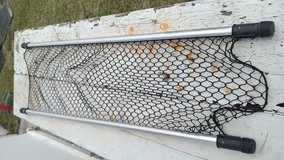 car & trucks inside rack in Okinawa, Japan