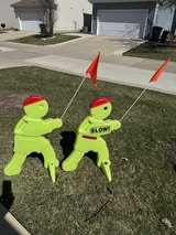 safety kids playing statues signs slow down caution in Yorkville, Illinois