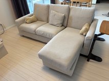 White couch with throw pillows in Okinawa, Japan