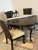 Table and three chairs for sale in Columbus, Georgia