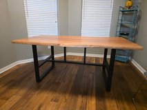 Solid wood and iron dining table in Kingwood, Texas