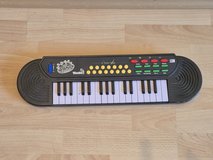 Toy keyboard and baby ear muffs for travel in Ramstein, Germany