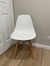 White plastic chair with wood base in Bartlett, Illinois