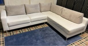 Real leather sectional couch with pillows in Ramstein, Germany