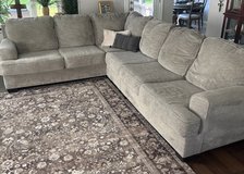 Large gray sectional sofa in Kingwood, Texas