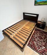 bed frame and night stand and light in Ramstein, Germany