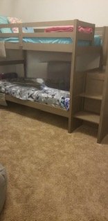 Grey slate bunkbed with attached stairs and 4  dresser drawers in Kingwood, Texas
