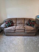 Brown soft sofa with 2 pillows in Anchorage, Alaska