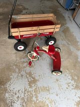 older Radio Flyer set of tricycle and all-terrain wagon with air tires and wood sides. in Batavia, Illinois