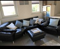 Black Leather couch with seat and ottoman in Ramstein, Germany