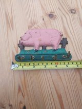 Vintage cast iron pig key holder plaque, wall mounted in Lakenheath, UK