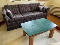 Striped sleeper sofa and table in St. Charles, Illinois