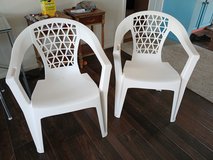 2 white plastic chairs in Alamogordo, New Mexico