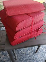 4 red outdoor chair cushions in Alamogordo, New Mexico