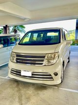 White Nissan Elgrand 8 Passenger Van in Okinawa, Japan